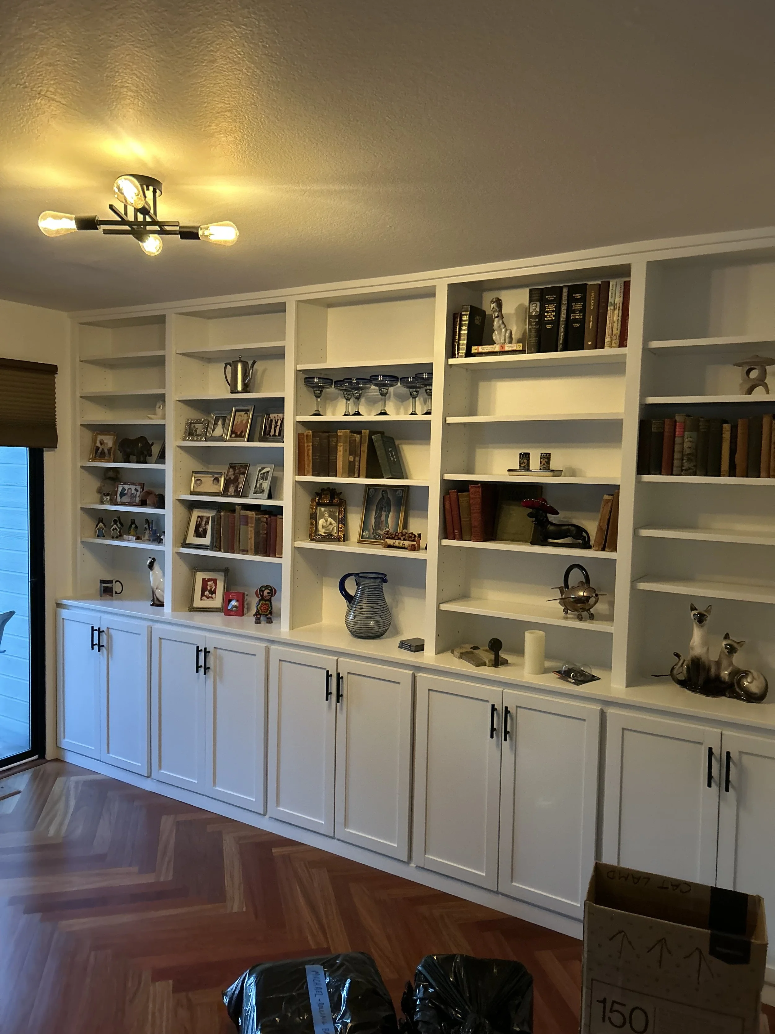  This cabinet and shelf system was built on a 10 foot span of wall changing the room dramatically and giving it a completely different feel.  The shelves are adjustable and the shaker doors open to reveal cabinets 2 feet wide, 2 feet deep in 2 feet h