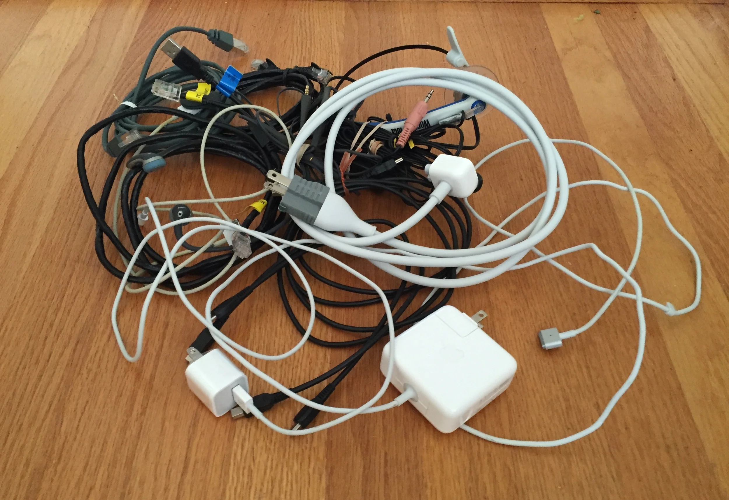 Collection of known usable wires that keep us "connected". In addition, there is a box somewhere that contains cords and wires to those electronic devices which have gone to the great beyond. 