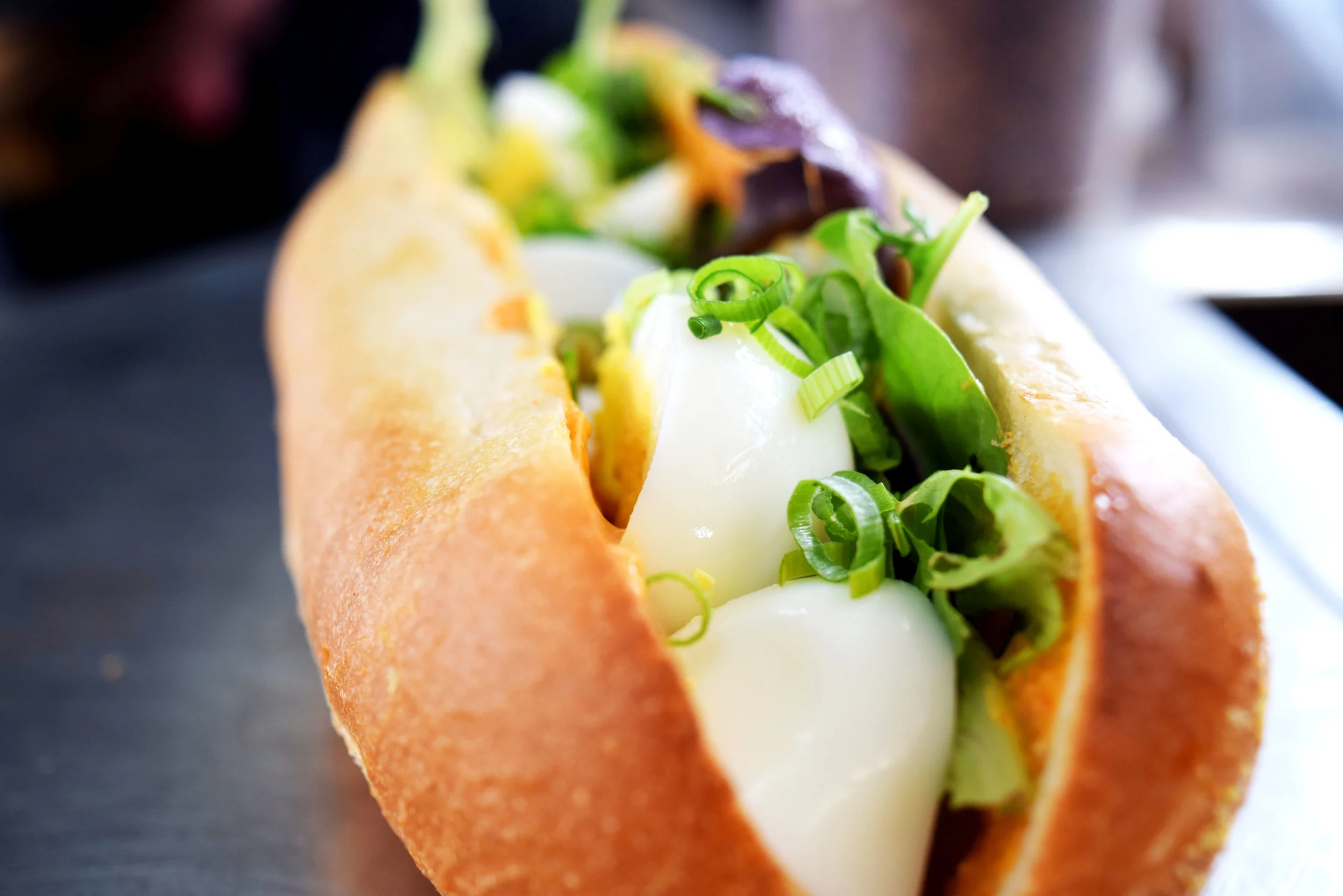 EGG SANDWICH sliced eggs, cucumber, spicy mayo, mesclun and scallions