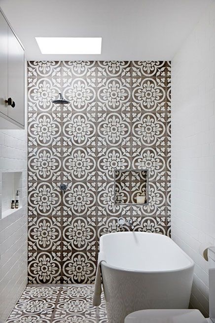 I love how the tile wraps up the wall from the floor - very striking in contrast to the white subway tiles.