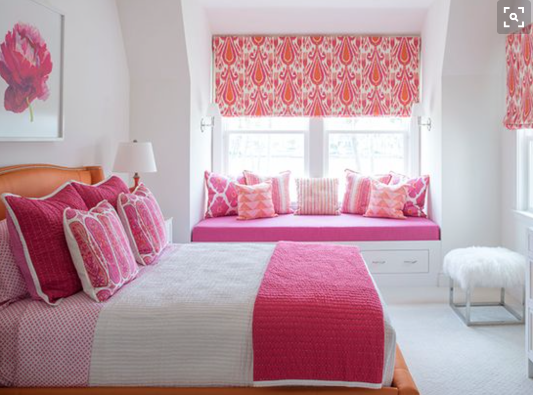 Another fun pink and tangerine girl's bedroom.