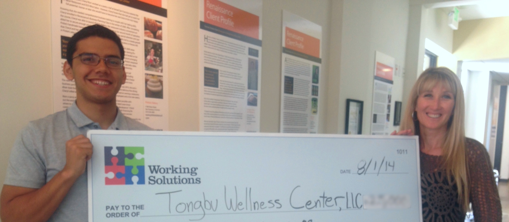 Working Solutions Business Lending Associate Roberto Hernandez with Tongbu Wellness Center Owner Heide Nielsen