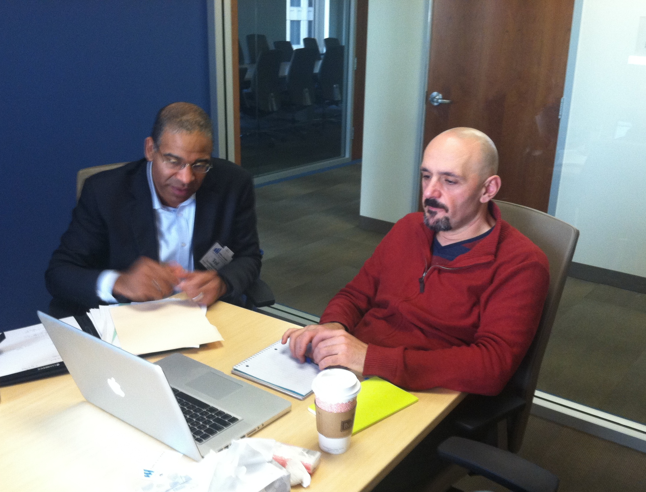 Ted Hilliard of Hilliard Management Group helps Working Solutions Client Ender Markal, owner of Richmond Republic Draught house, set up his Quickbooks Software