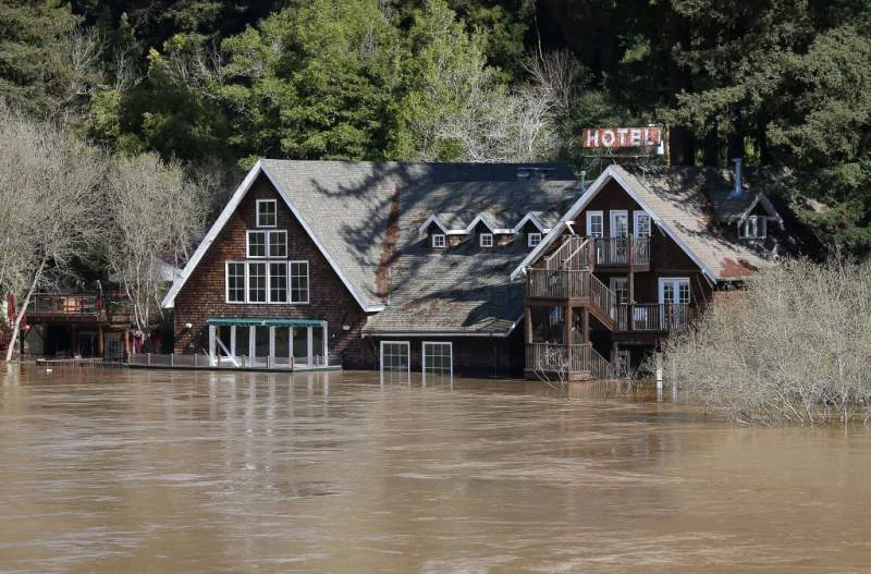 Water from the Russian River surrounds Highland Dell Lodge in Monte Rio on Thursday, February 28, 2019. Photo by Christopher Chung, The Press Democrat