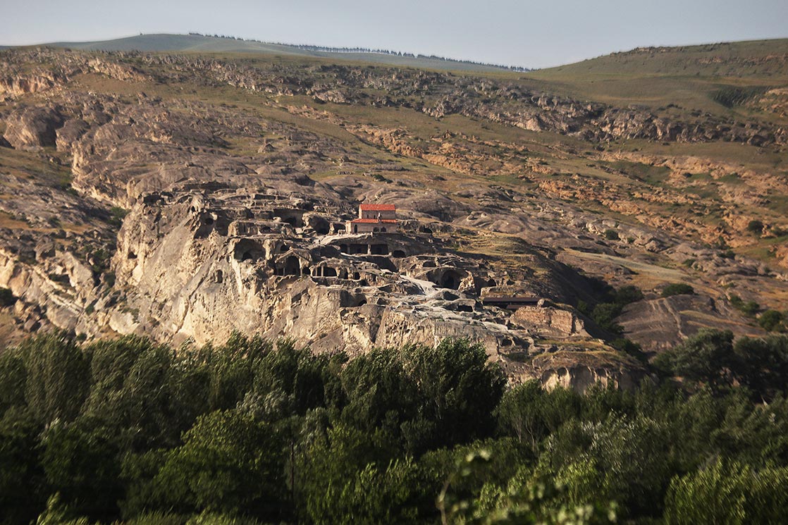 Front of Uplistsikhe , an ancient rock-hewn. Built on a high rocky left bank of the Mtkvari River, it contains various structures dating from the Early Iron Age to the Late Middle Ages | GEORGIA