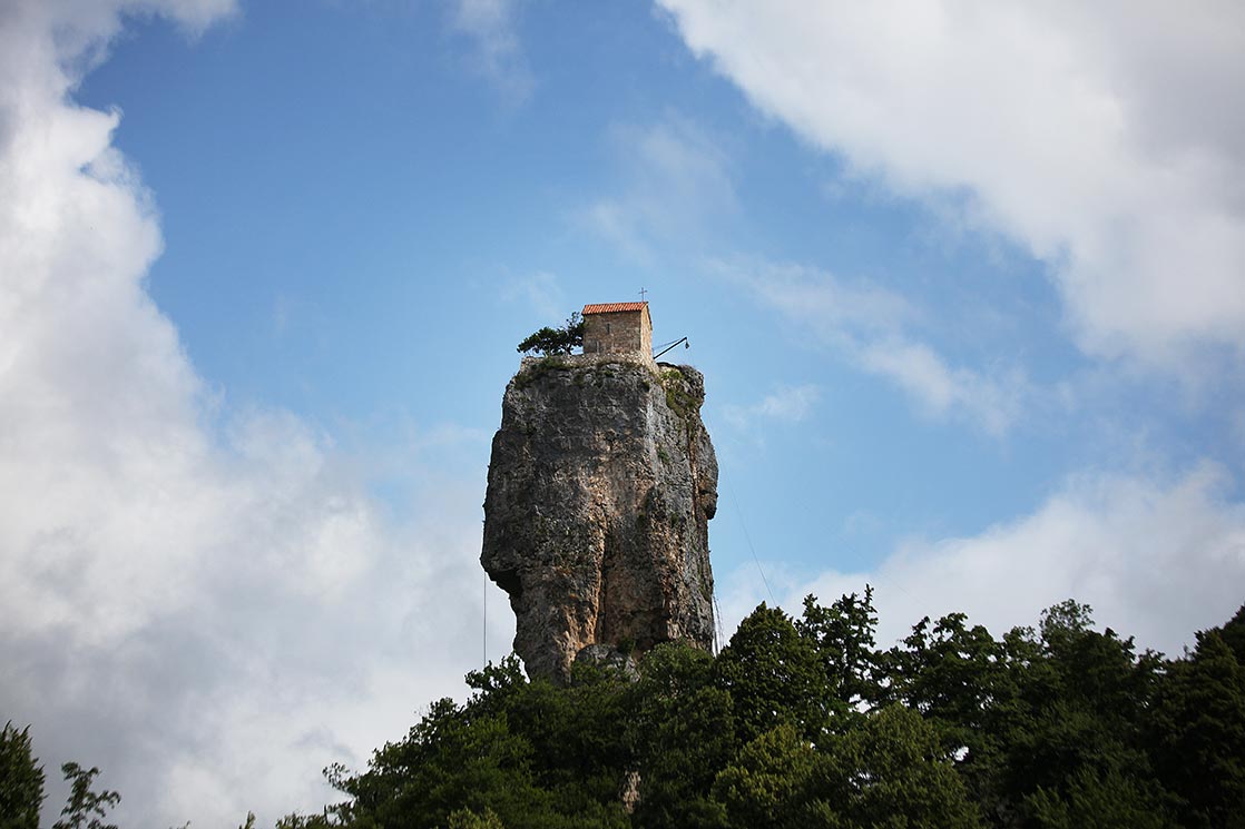 The Katskhi pillar is a natural limestone monolith located near the town of Chiatura. It is approximately 40 meters. The rock, with visible church ruins on its top surface, has been venerated by locals as the Pillar of Life, symbolizing the True Cross. The church dating from the 9th or 10th century | GEORGIA