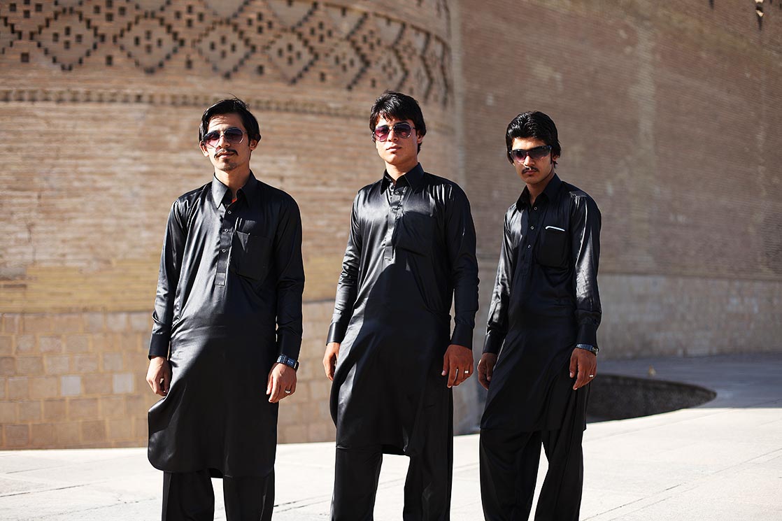 3 youngs balutchis in front of the Arg-e Karim Khan in Shiraz | IRAN