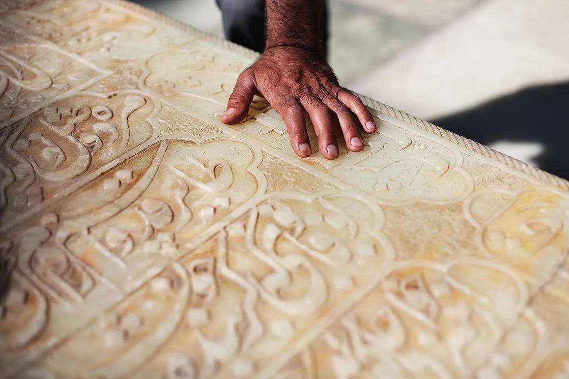 The marble tombstone is engraved with a long verse from the poet. Iranians have a saying that every home must have two things : first the Quran , then a collection of the works of Hafez ...