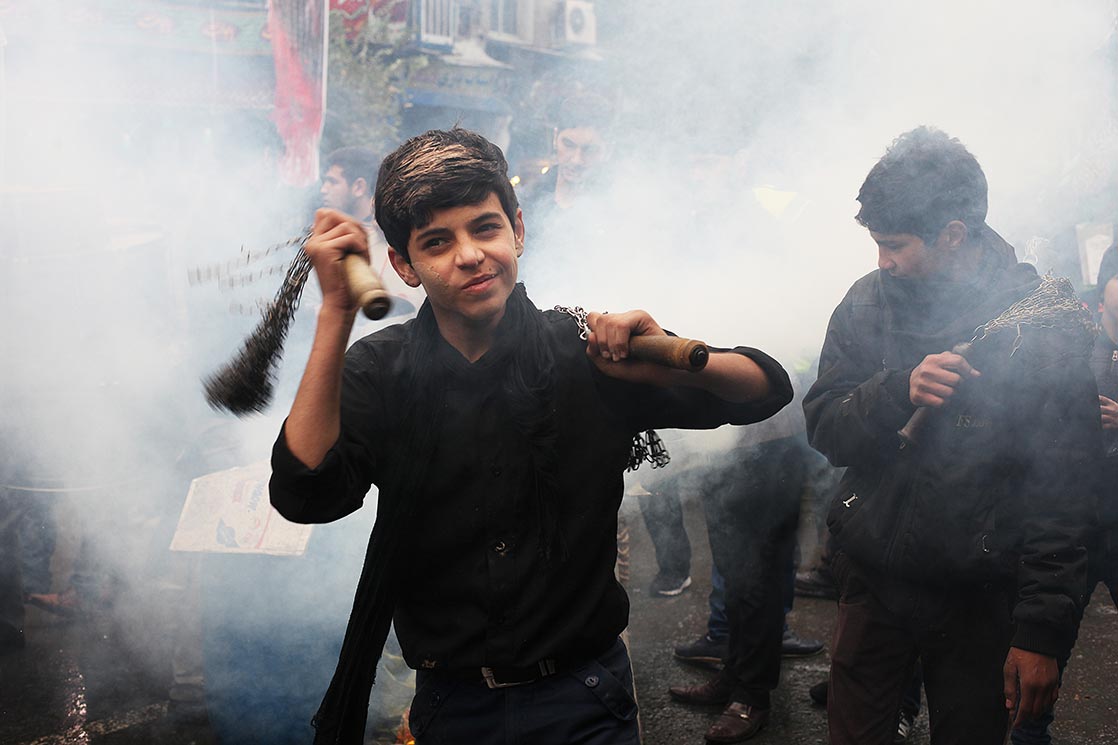 Shia Muslims (Shiites) commemorate the death of the third Imam, Hussein , slain along with 72 of his comrades in a battle against the army of seventh-century caliph Yazid. During the processions, mourners simulate self-flagellation with chains to the thump of a bass drum | Mashhad | I RAN