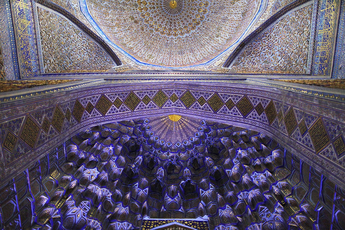 Inside the mausoleum of Guri Amir . Some deep niches and diverse muqarnas decoration. | UZBEKISTAN