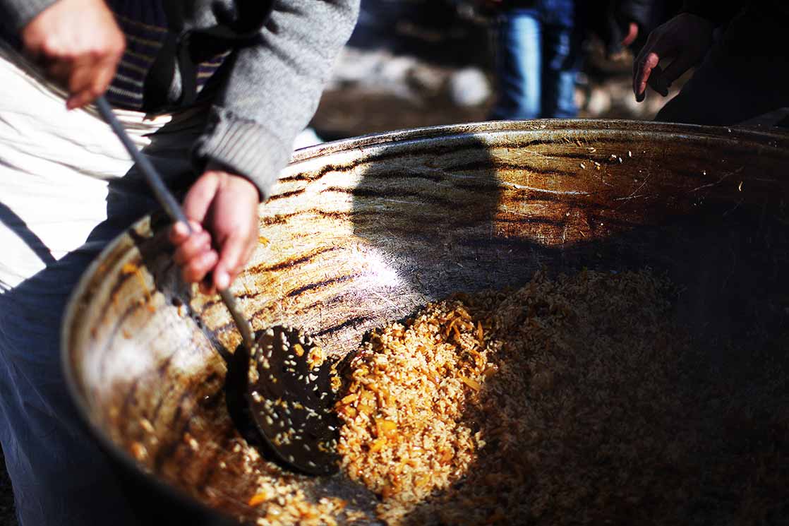 A giant Plov , a cult dish of Central Asia, in which rice is cooked with carrot and garlic | KYRGYZSTAN