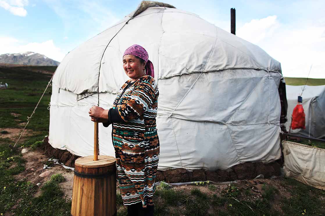 A woman preparing the Kumis , a fermented dairy product traditionally made from mare's milk. The drink remains important to the peoples of the Central Asian steppes | KYRGYZSTAN
