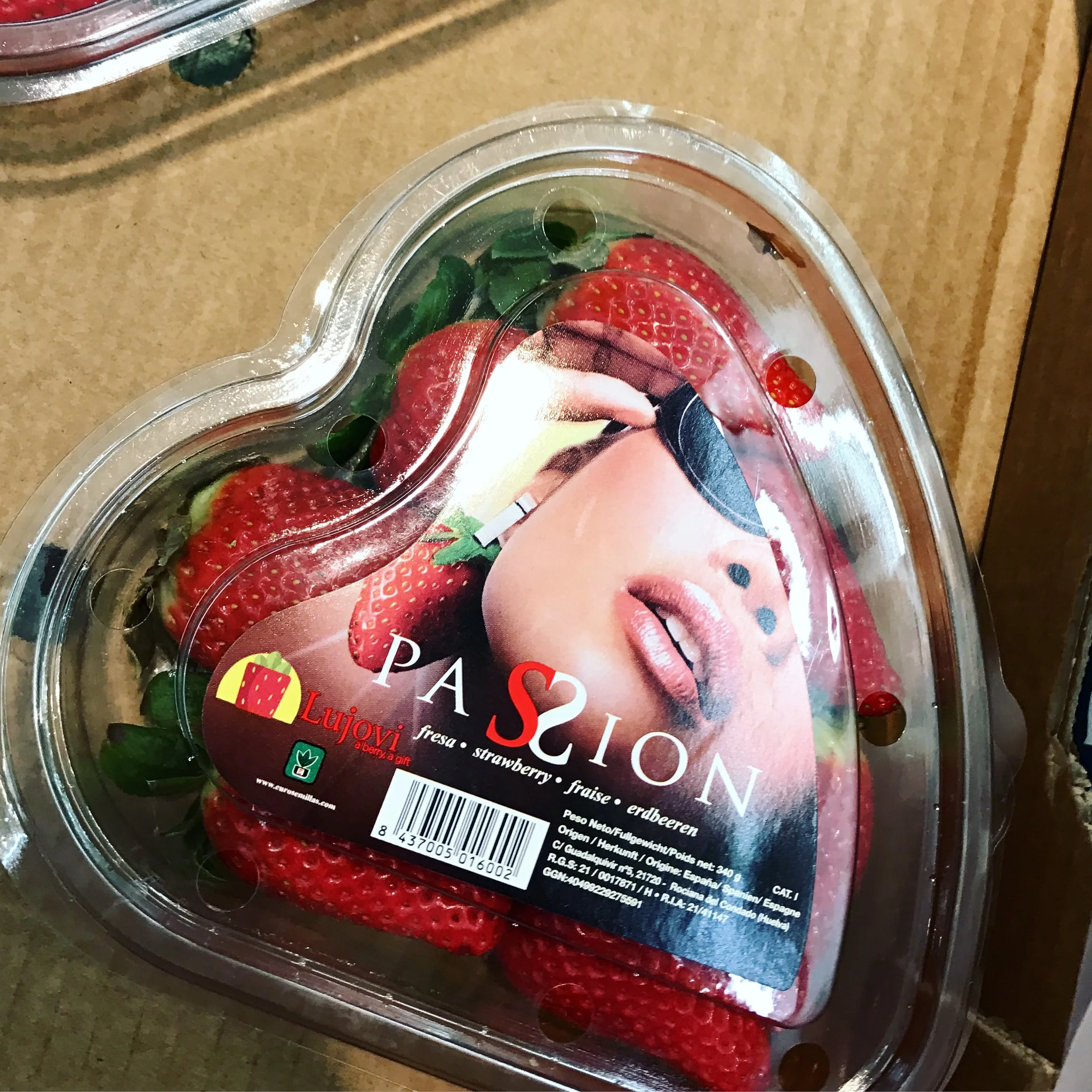 VERY luxurious strawberries at the local grocery store. Very passionate and I wish I had a clip on strawberry earring like her. 