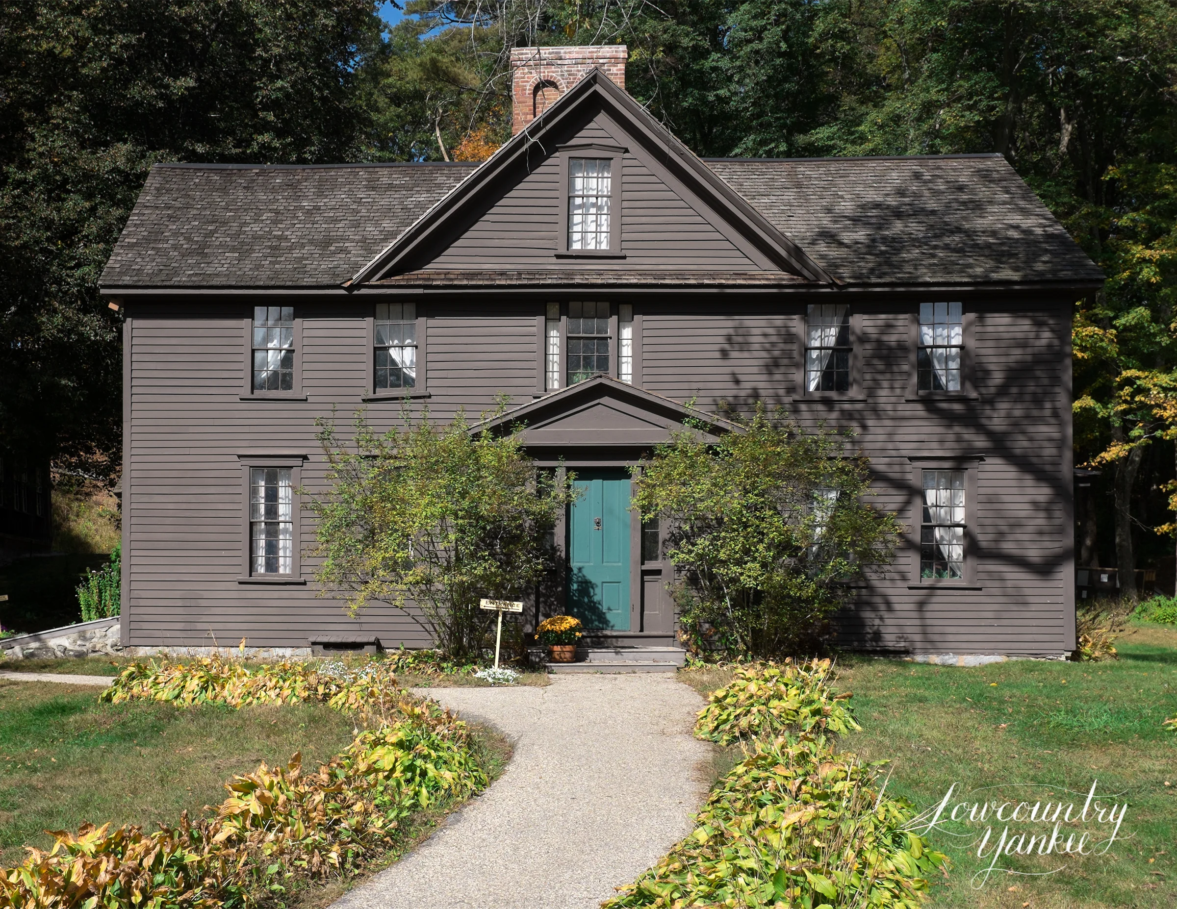 Orchard House where Louisa May Alcott wrote and set Little Women. In between the two upper-right windows, Bronson Alcott built a desk for Louisa. It was here that she penned her famous novel.