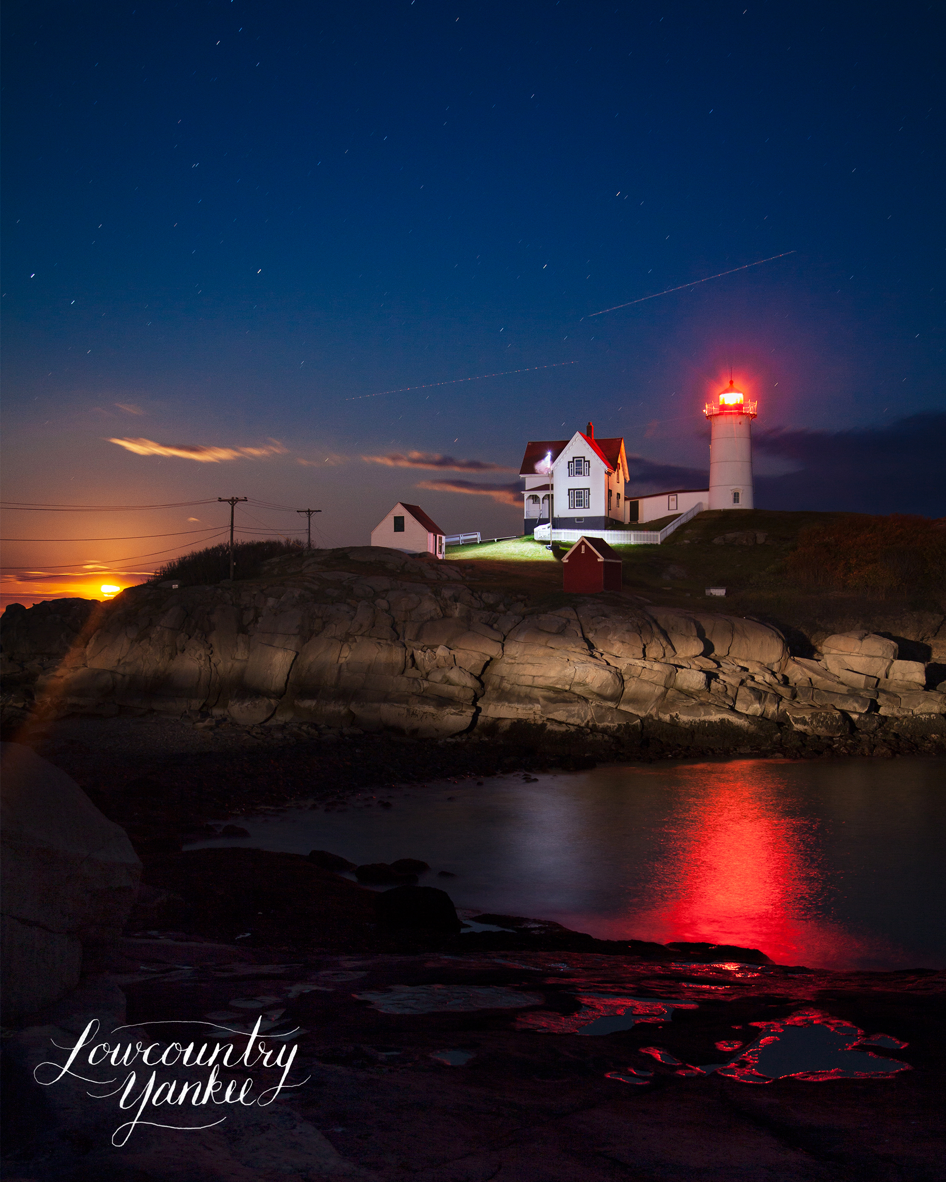 The moon rising behind the Nubble Lighthouse. York, ME