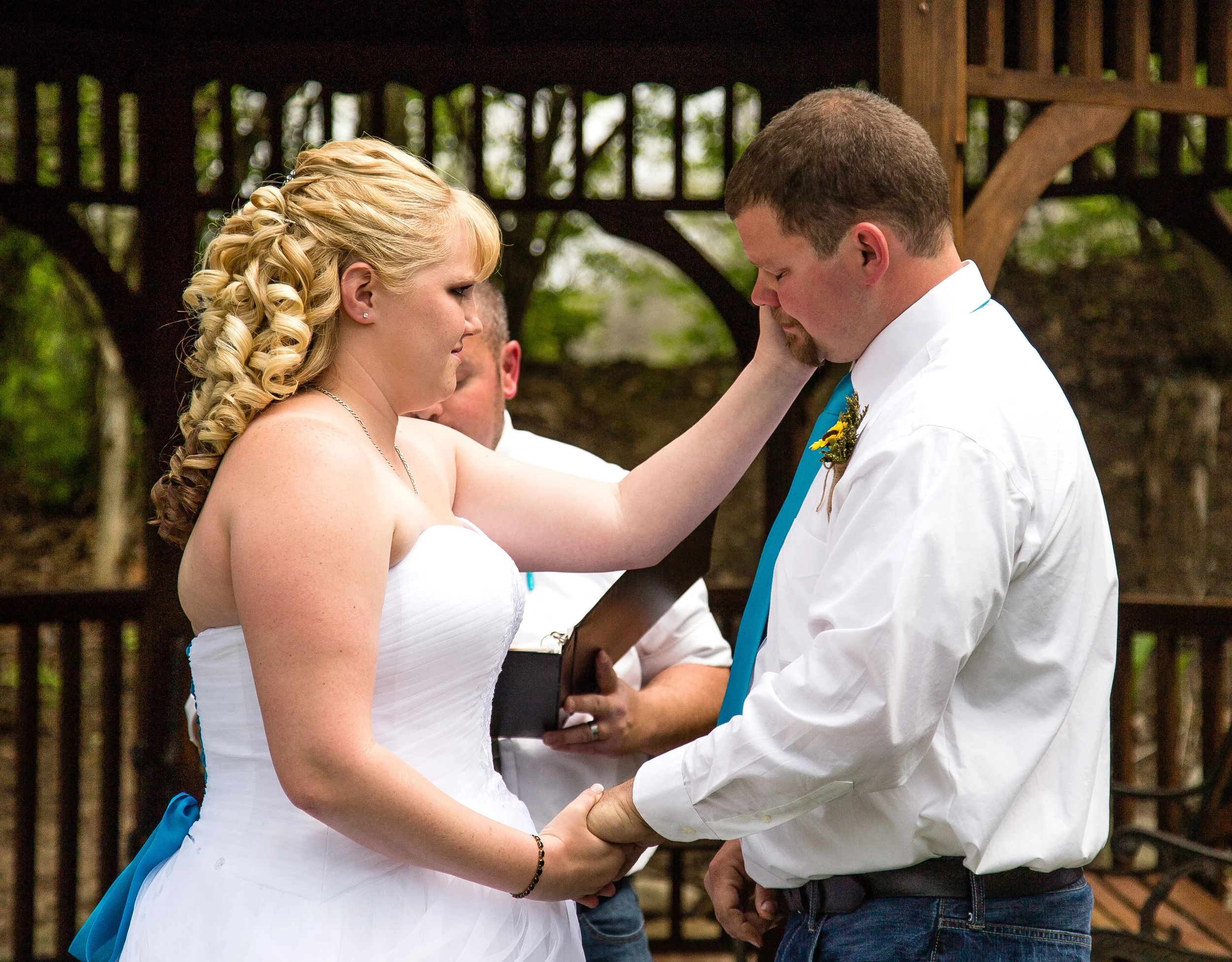 Candid photograph of a bride and groom during wedding ceremony