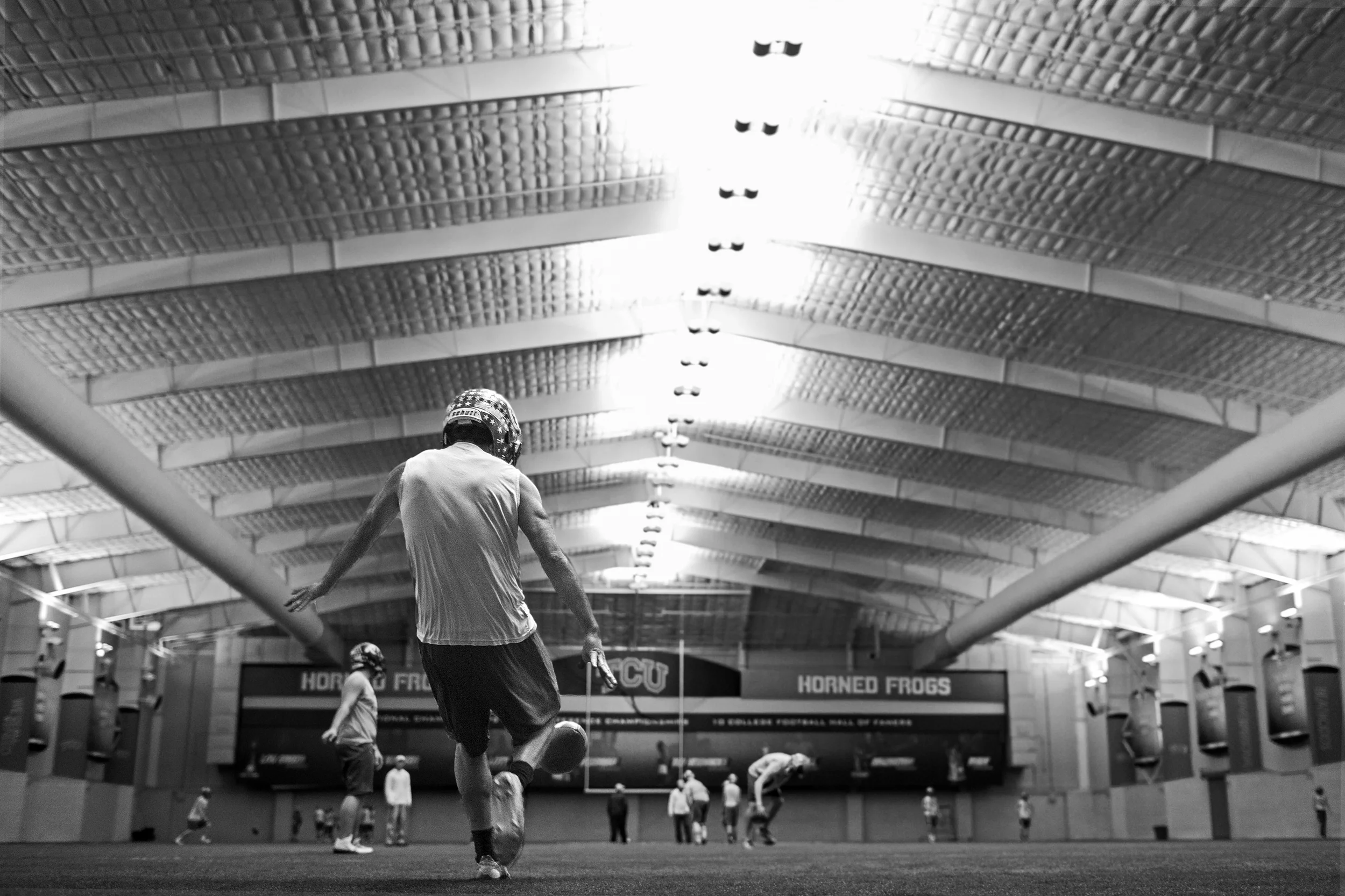 Luis Castillo practices punting at Sam Baugh Indoor Practice Facility in the Texas Christian University campus in Fort Worth, Texas on Dec. 17, 2014.