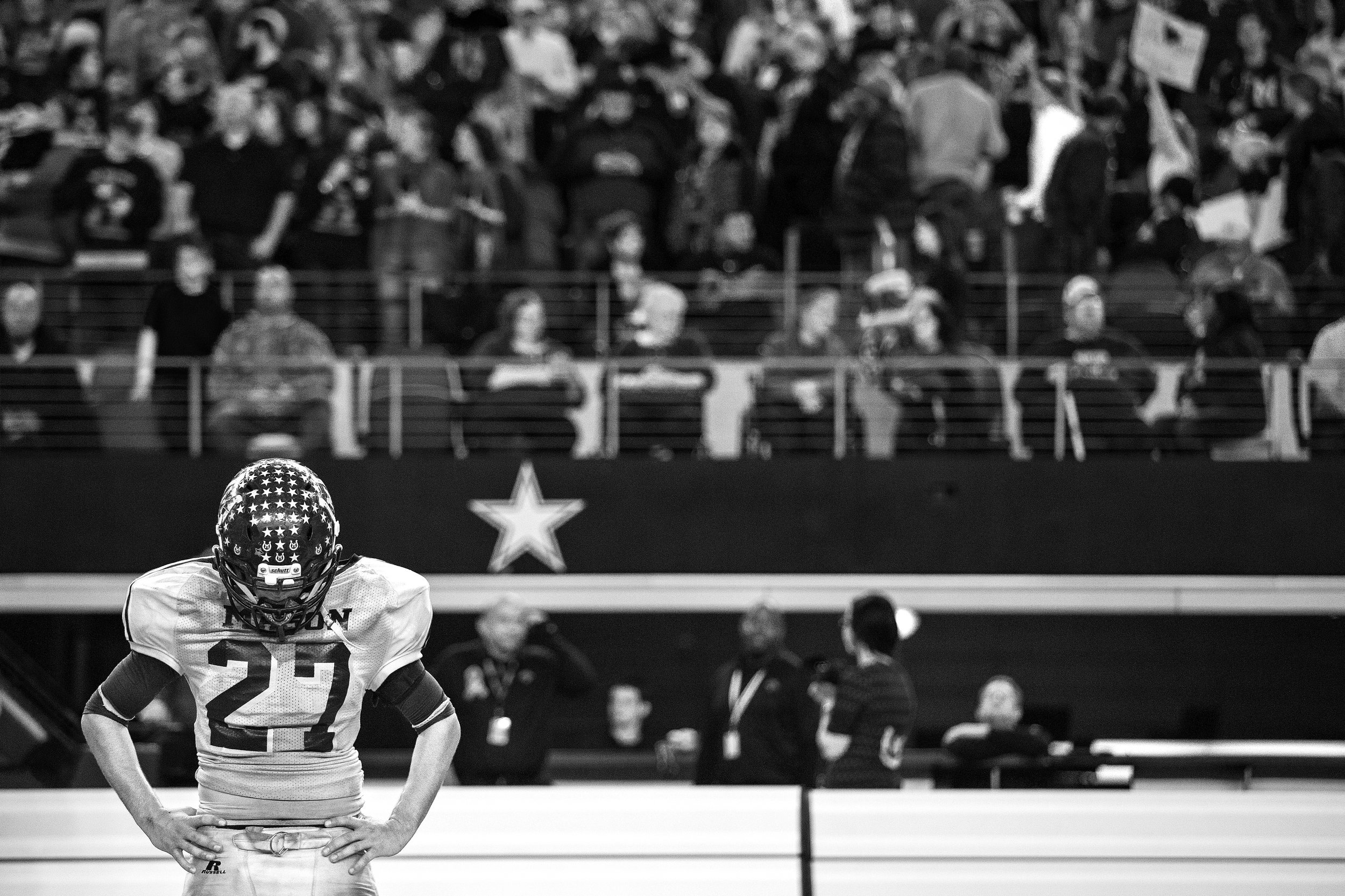 Luis Castillo stands in dejection seconds after the last game of his career ended with a 34-7 defeat at the hands of Canadian High School on Dec. 18, 2014 in Arlington, Texas. The Punchers were outplayed from the start of the game, only managing to score one touchdown in the first series of the game.
