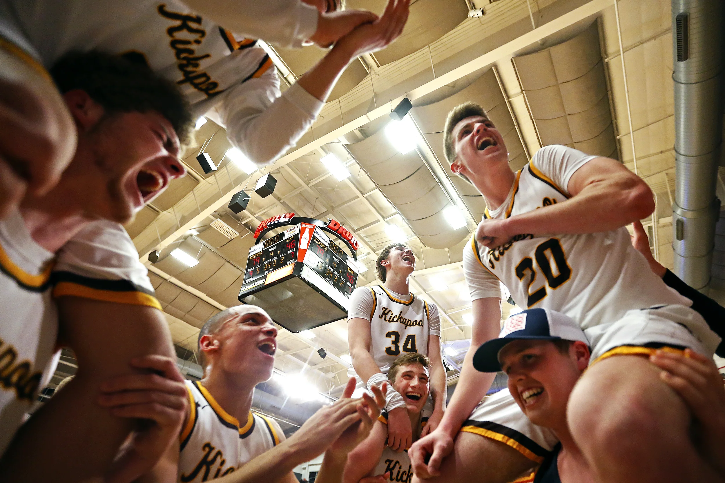Kickapoo Chiefs players celebrate after the end of the MSHSAA Class 5 sectional playoff game between the Kickapoo High School Chiefs and the Nixa High School Eagles at the O'Reilly Family Event Center in Springfield, Mo. on March 8, 2017. The Kickapoo Chiefs won the game 79-46.