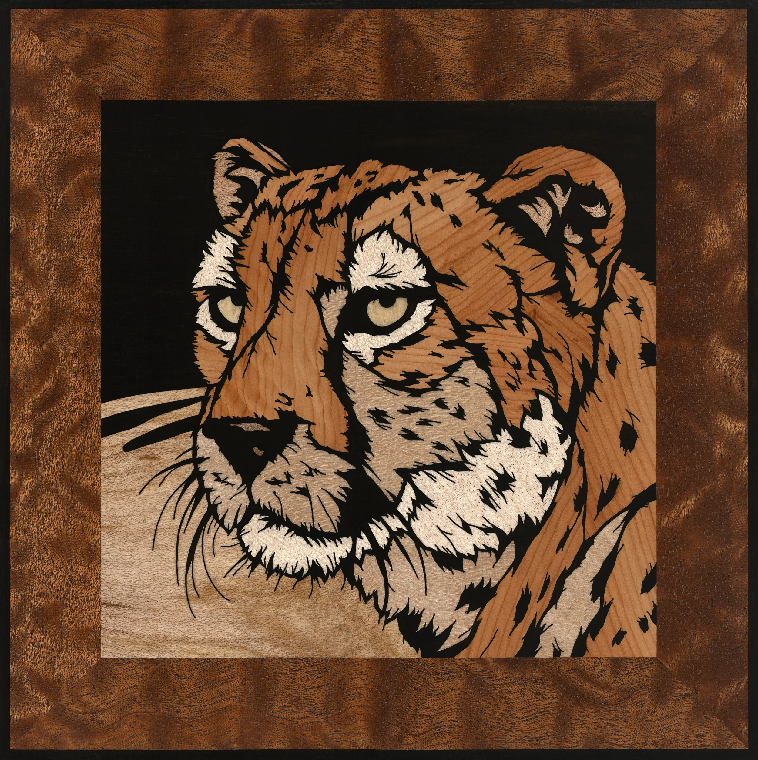 hand cut wood inlay of a cheetah cut by hand by Jack Smidmore using yew, maple and ebony with a spalted maple and ebony background