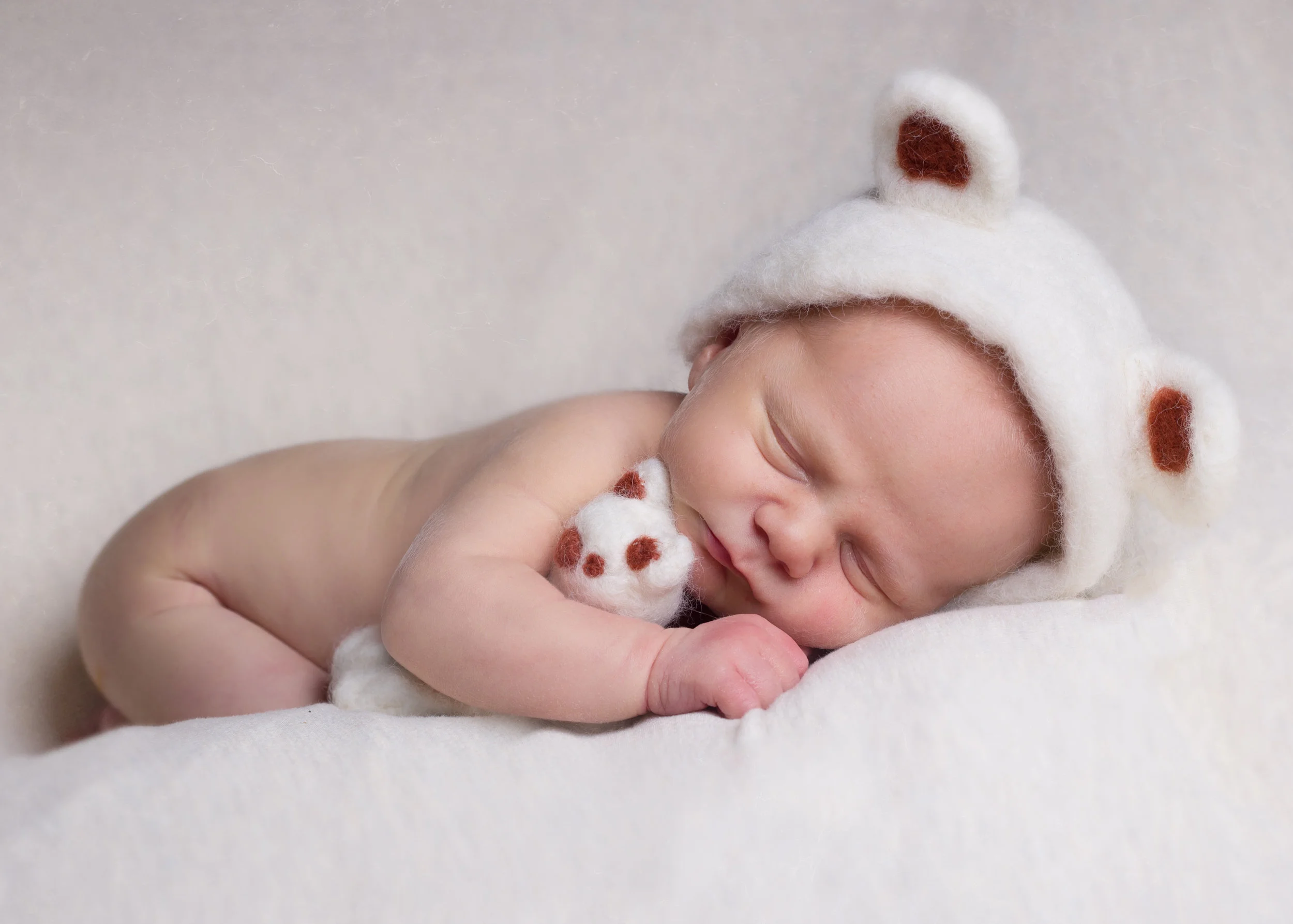 newborn with teddy.jpg