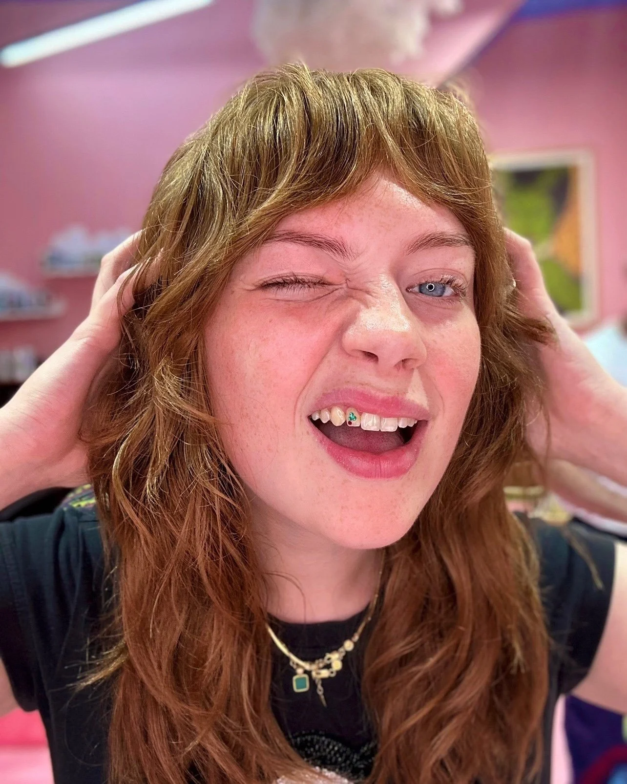 Long copper shag haircut with a fringe and textured face-framing layers