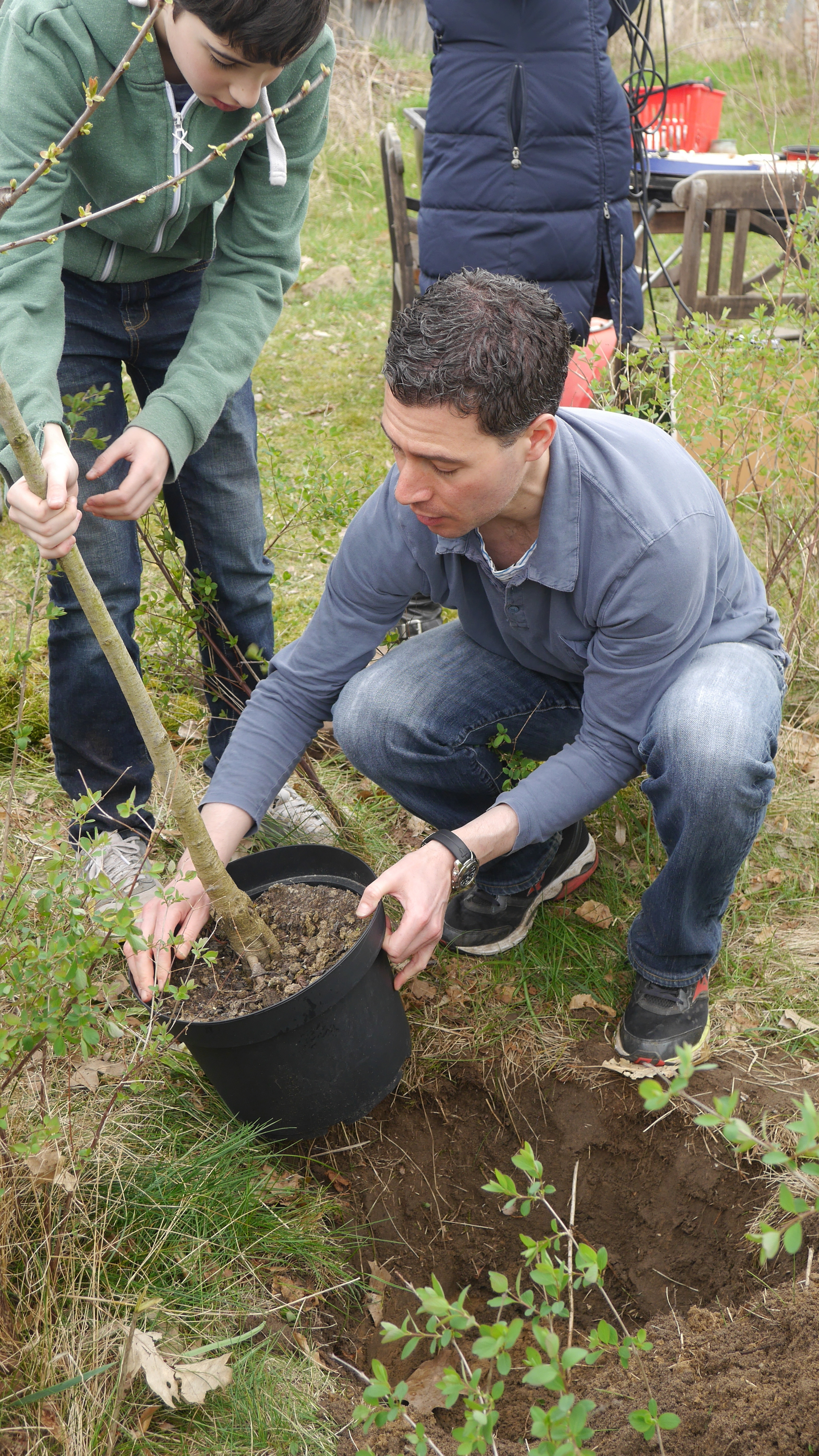 Leo and Robert Datnow plant cherry tree.JPG