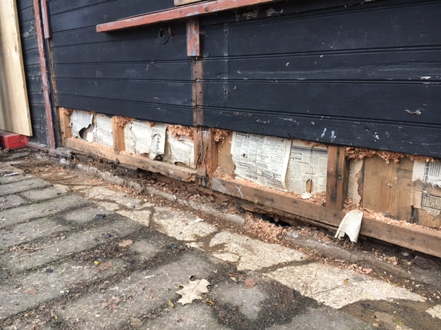 Front of house showing 1920s newspaper insulation