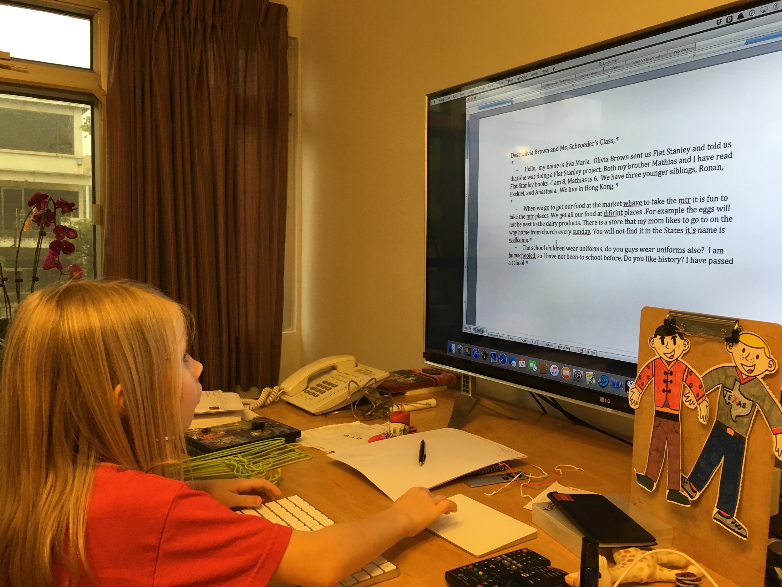 Eva Maria writing her Flat Stanley letter. 