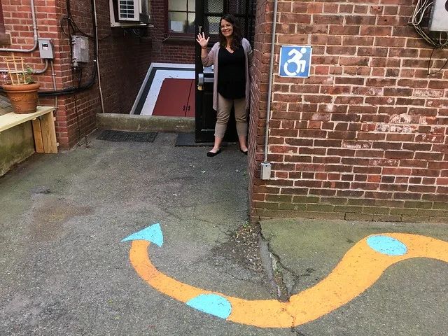 Cat welcomes audiences through the wheel-access entrance, one of the many projects she worked on while at Puppet Showplace Theater.
