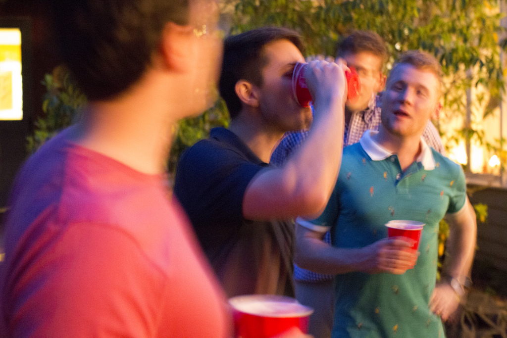 College students down beers at a local party.