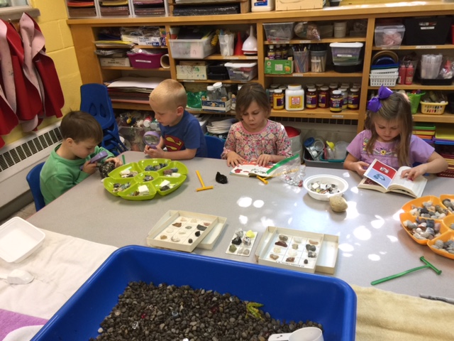  Students in our pre-K class examine rocks and minerals to determine differences and things that make them unique. 