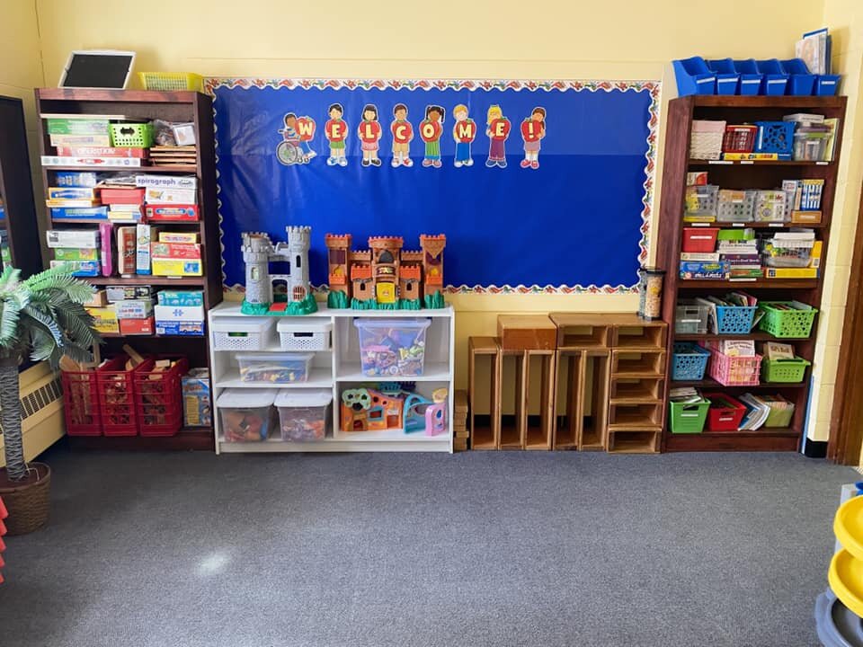  4s/Pre-K Classroom: The Yellow Room  Here students engage in creative play! This room often features imaginative play areas that go along with what students are currently learning about. The Discovery Room also houses the 4s/Pre-K lending library. 
