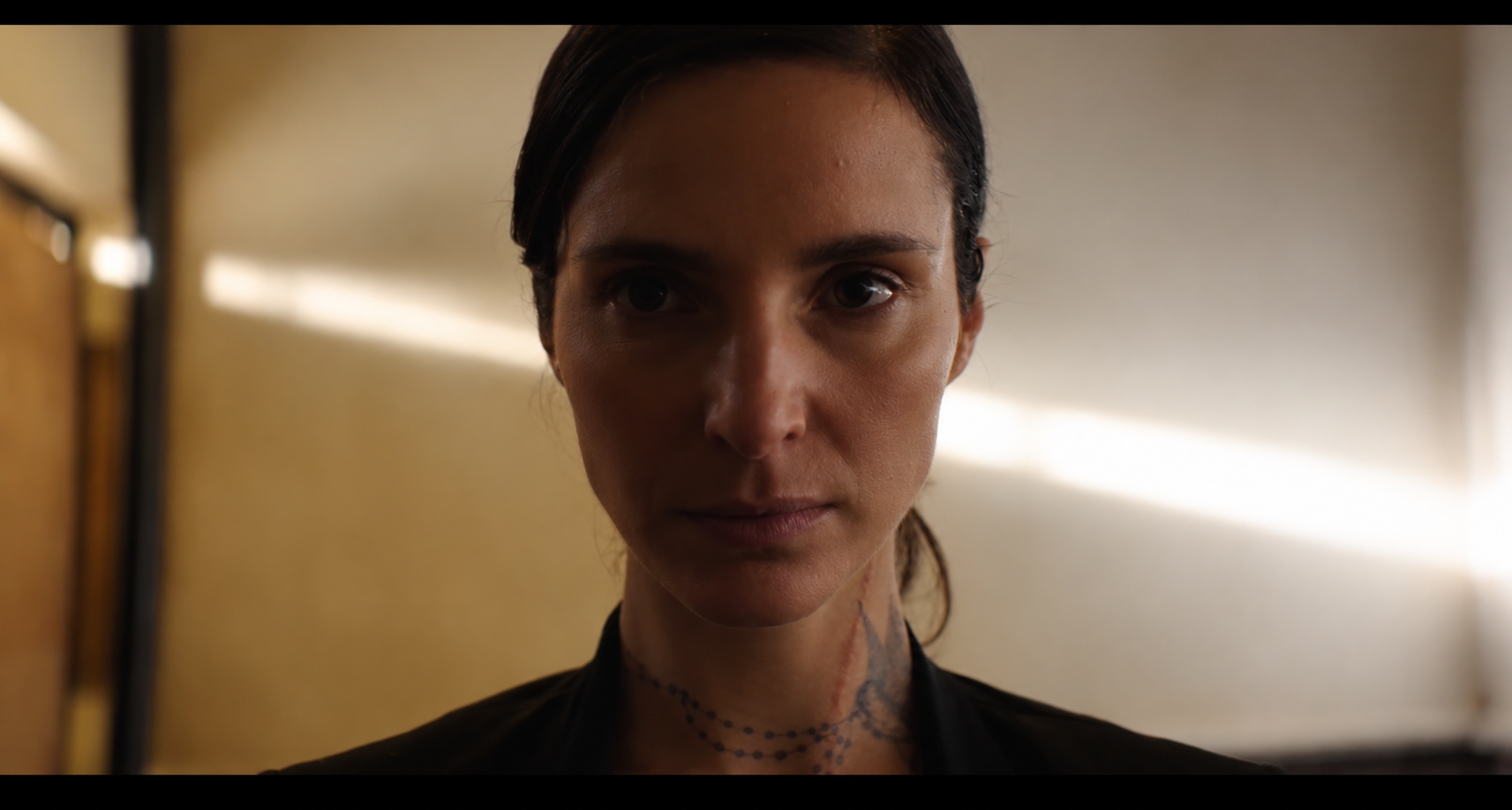 Cinematic Portrait with Neck Tattoos.png