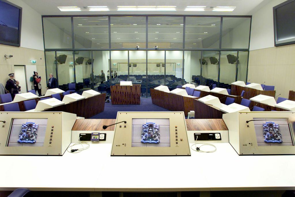 In an unprecedented legal arrangement, the venue of the trial was Camp Zeist in the Netherlands, a former U.S. military base that had been turned into a Scottish territory for the duration of the proceedings. The trial was held in a special courthouse built on the site, with enough room to hold large amounts of Flight 103 victim family members. Live video feeds were also provided in New York City, Washington D.C., London and Lockerbie, for family members who could not make the trip. Interior views of the Scottish courtroom built specifically for the Pan Am Flight 103 trial at Camp Zeist, Netherlands.