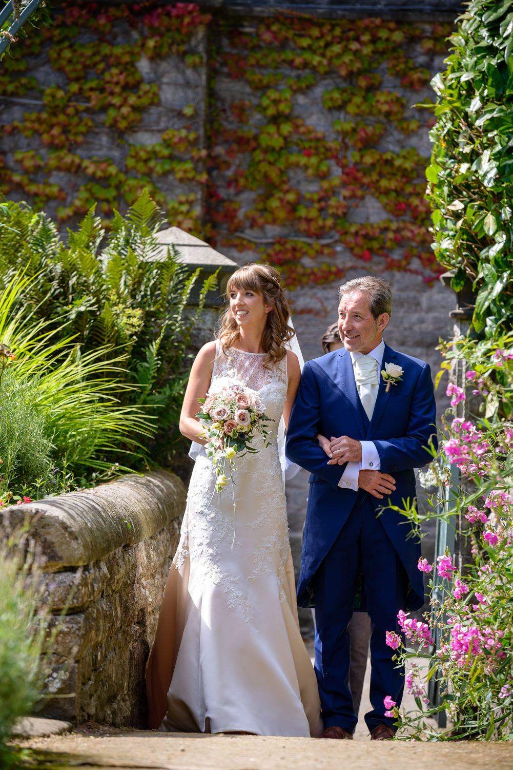 bride and her father walk down the aisle at Callow hall wedding