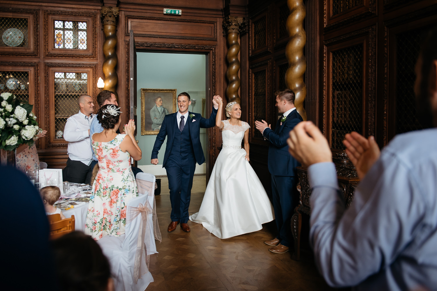 bride and grroms arrival into the great hall at burghley house