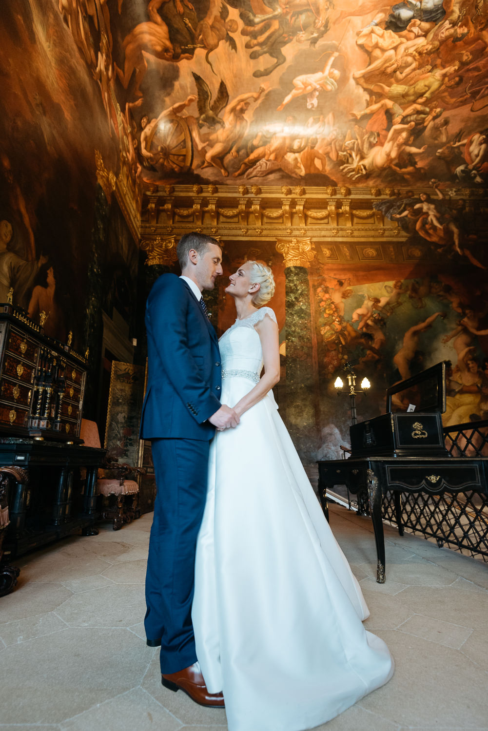 Bride and groom portrait on the hell staircase at Burghley Hose