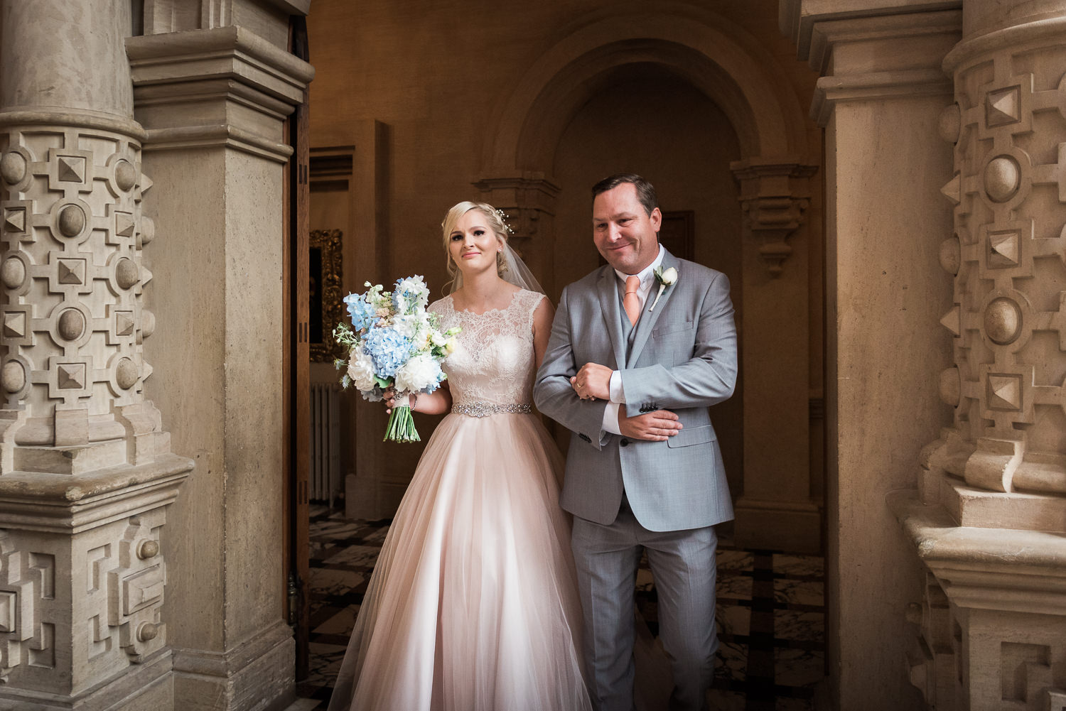 Bride walking down the aisle at Harlaxton Manor wedding