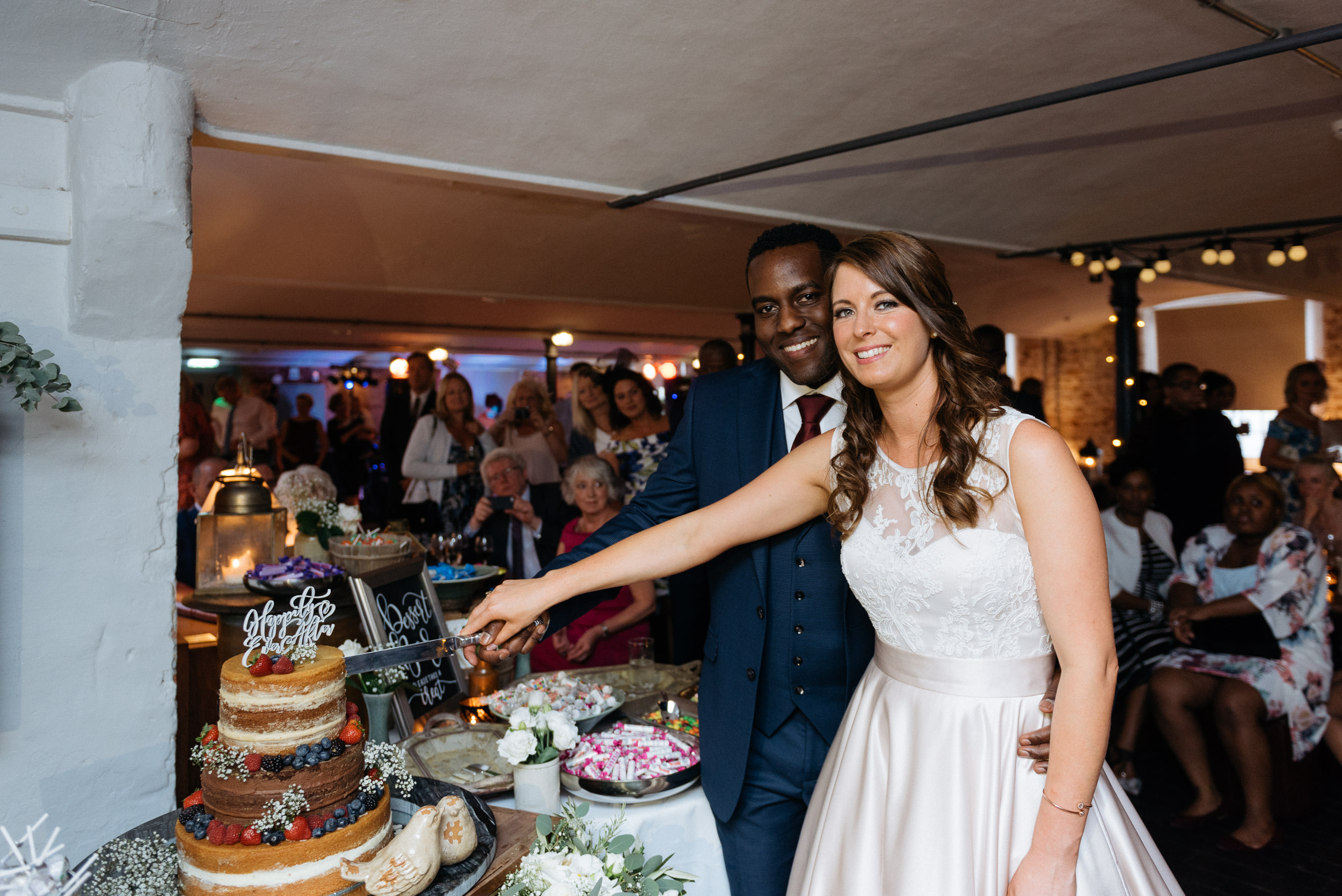 Cake cutting at The West Mill Wedding