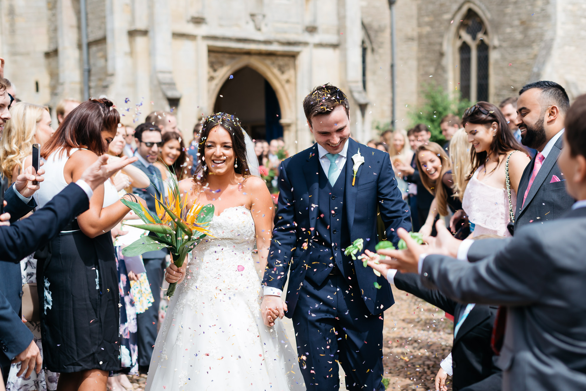 Bride and groom leaving church in Oundle