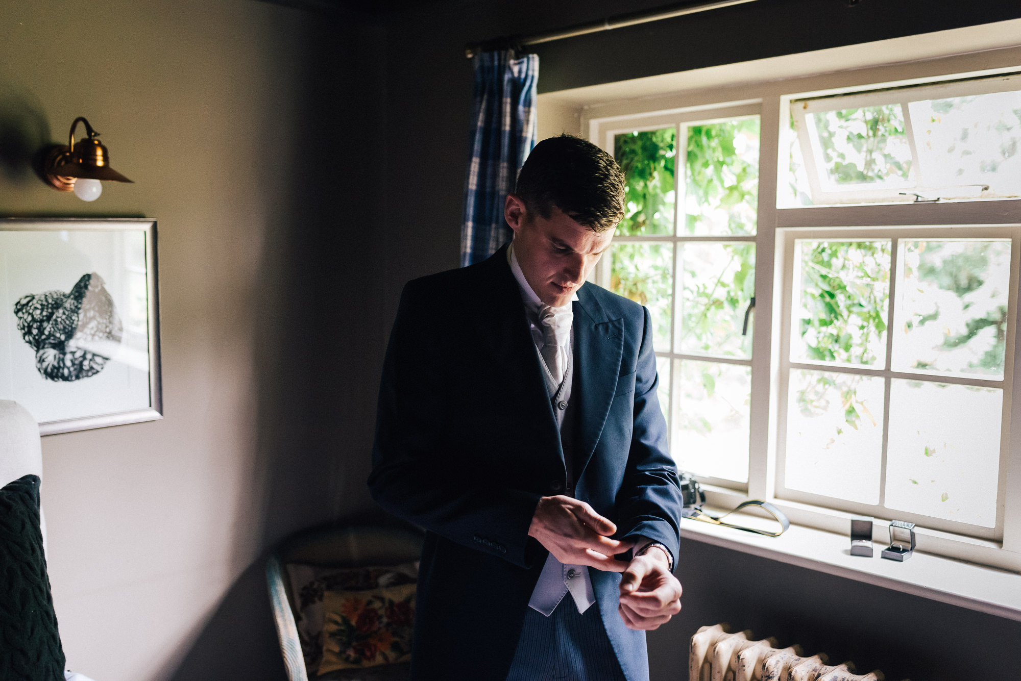 Groom getting ready at Narborough Hall Gardens