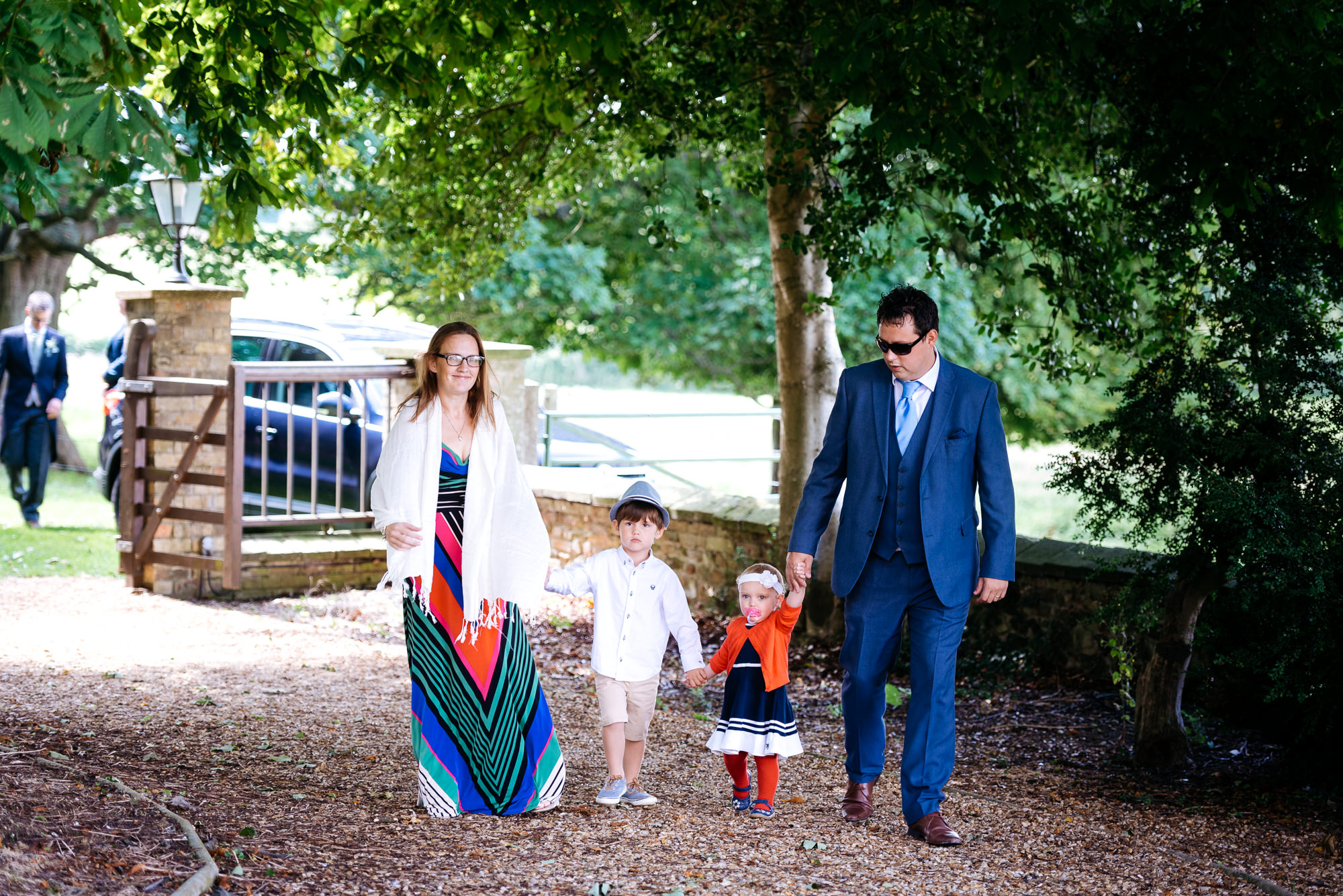 Wedding guests arriving at church in Narborough