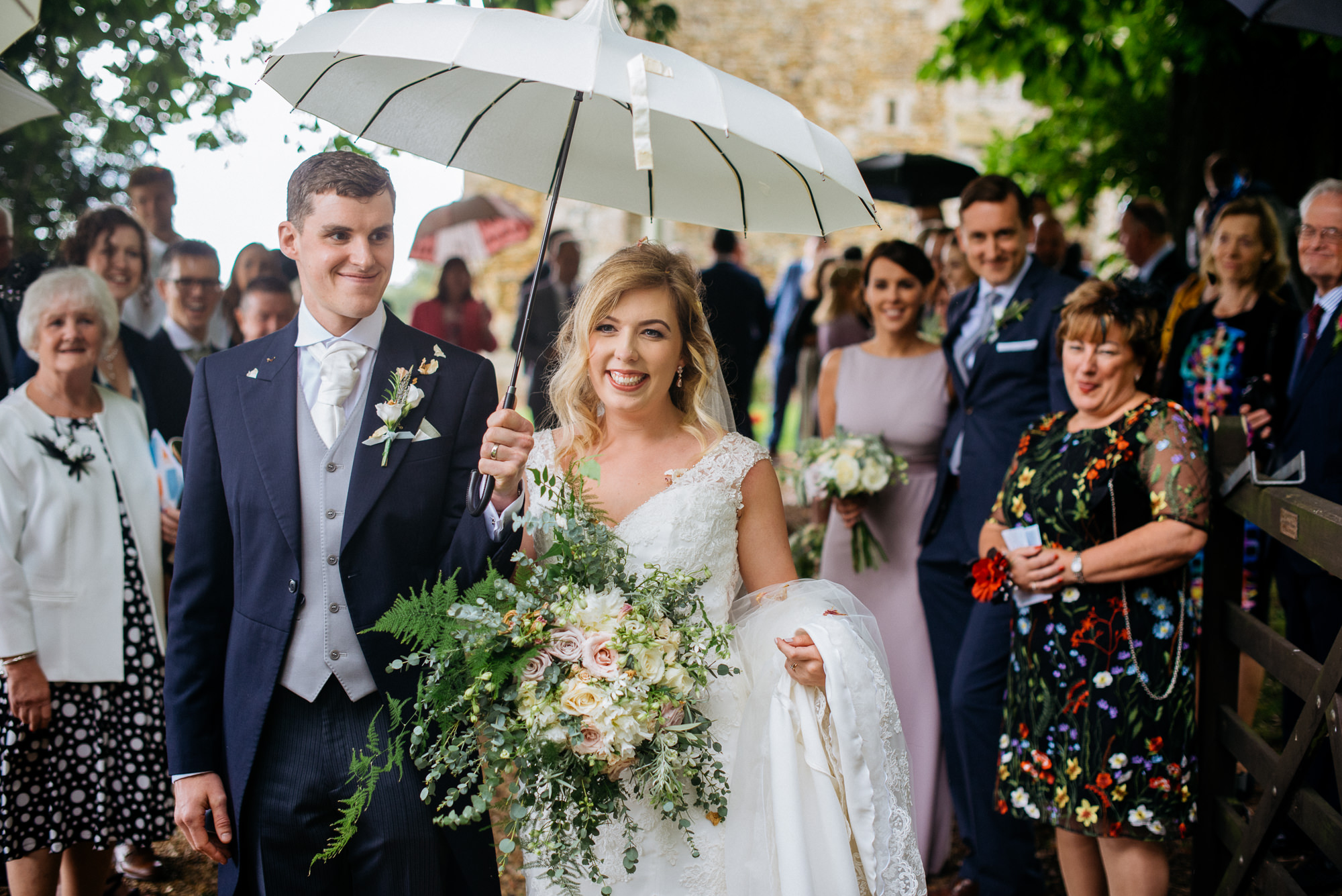 Bride and groom confetti throw at narborough hall gardens wedding