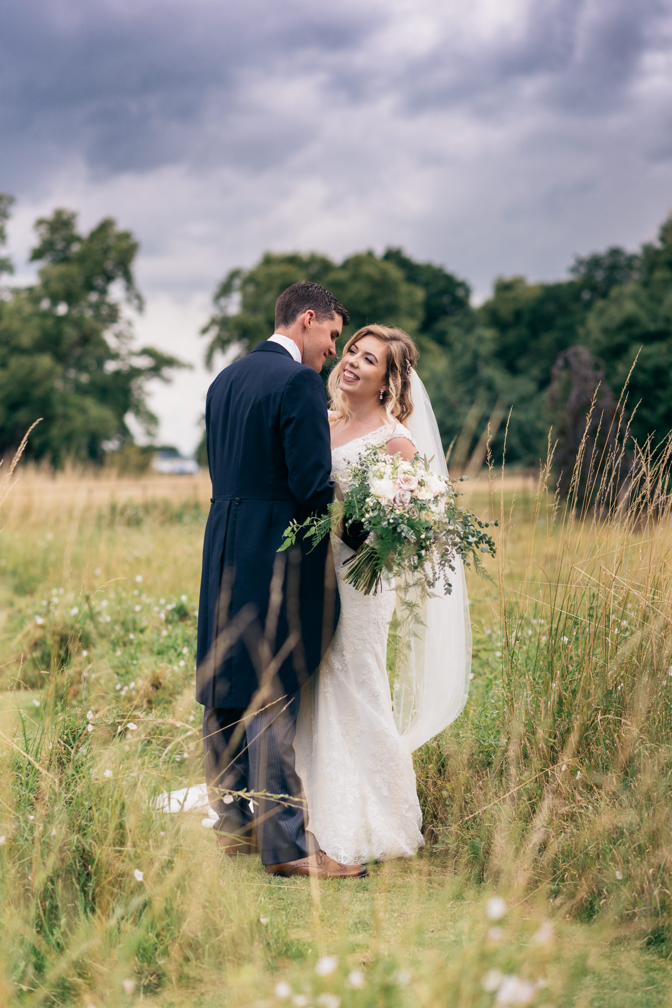 Portrait of the bride and groom at Narborough Hall Gardens in Norfolk
