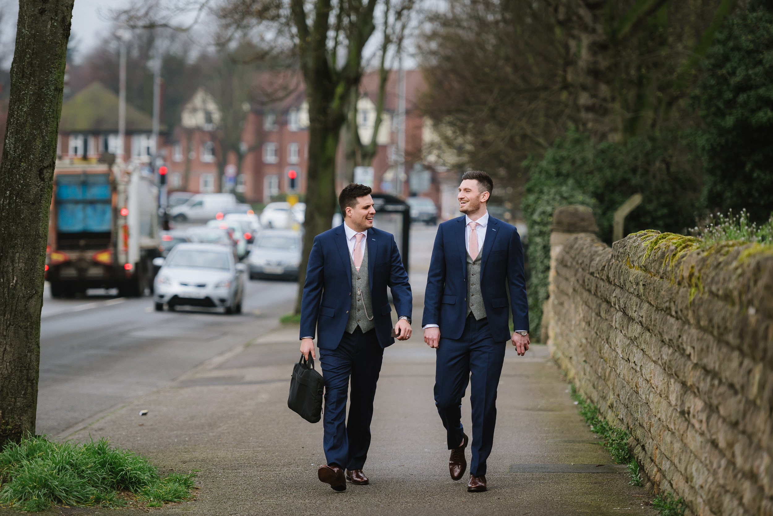 groom and bestman walking to church