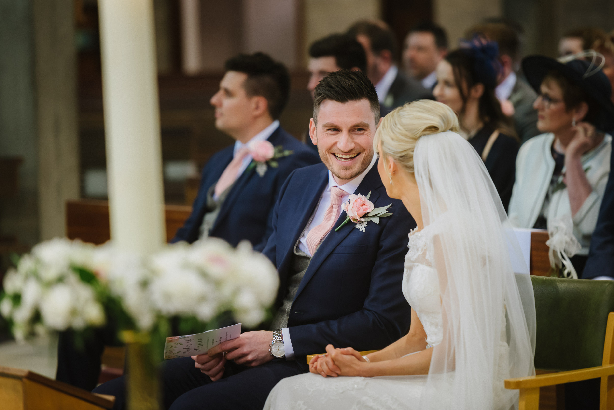 Bride and groom during their wedding ceremony at the Good Shepherd Church in Woodthorpe, Nottingham
