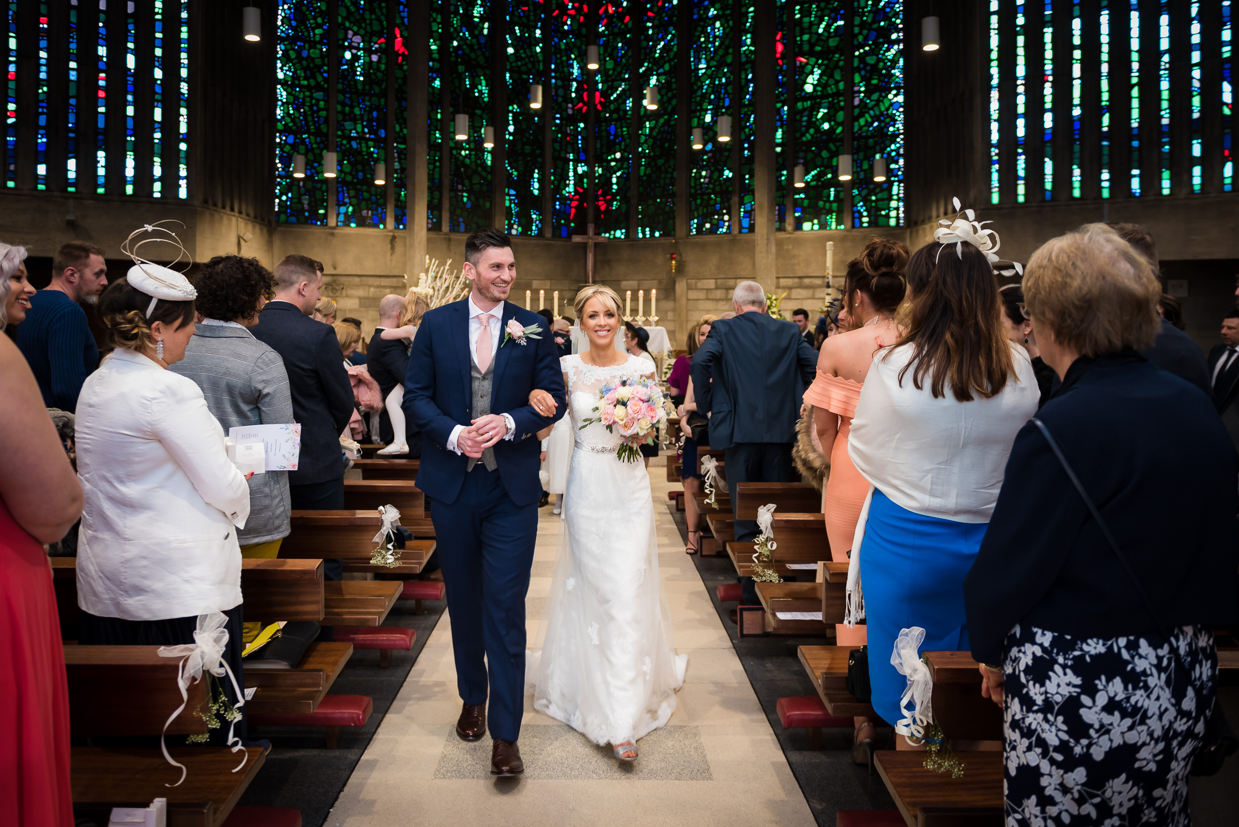 bride and groom leaving the church carriage hall wedding photographer