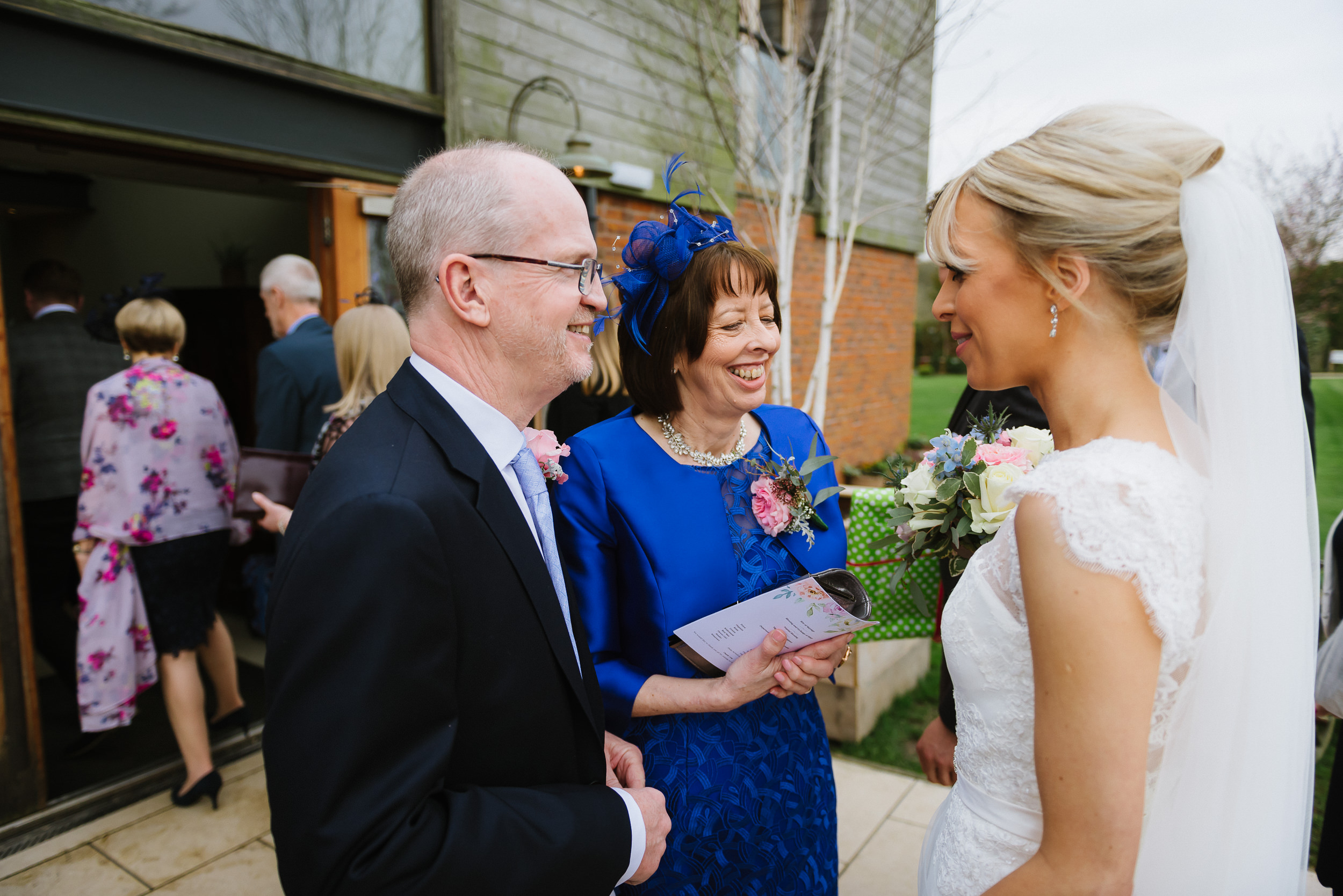 Bride with her parents at her wedding at Carriage Hall in Plumtree