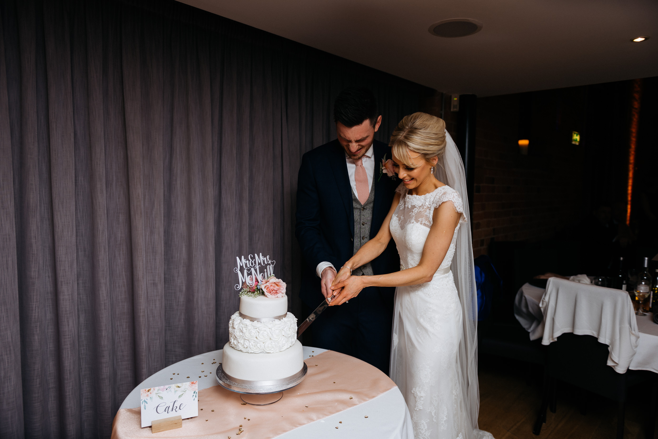 cutting the wedding cake at Carriage Hall